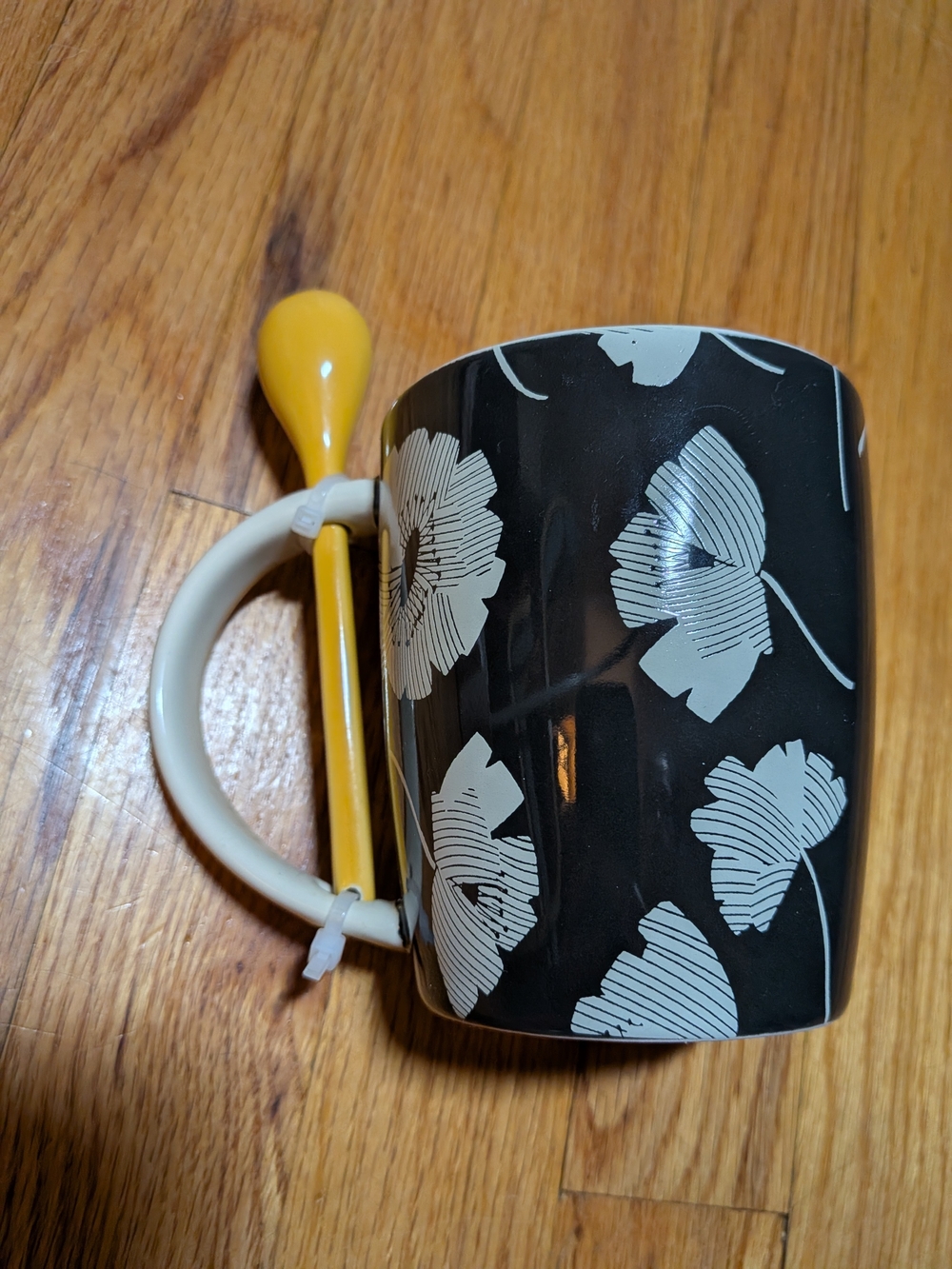 Tabitha Black Floral Ceramic Mug with Yellow Stirring Spoon